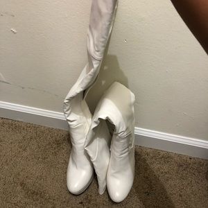 Tall white knee high boots